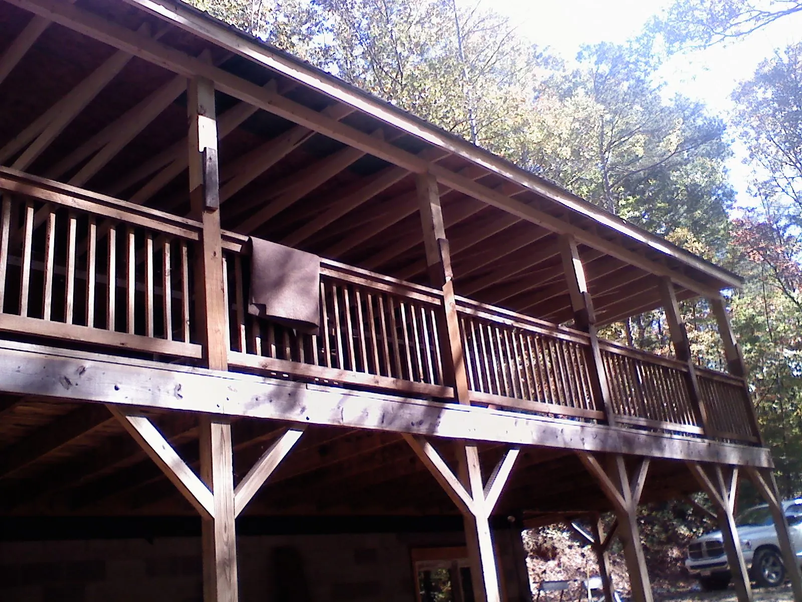 Timber framing under a new elevated porch and deck — Roof Leak Repair in Ottawa by Roofing Brothers